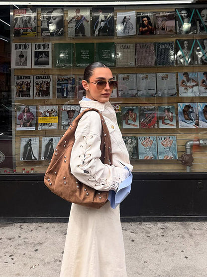 Sac à main féminin design avec détails en perles et coupe originale