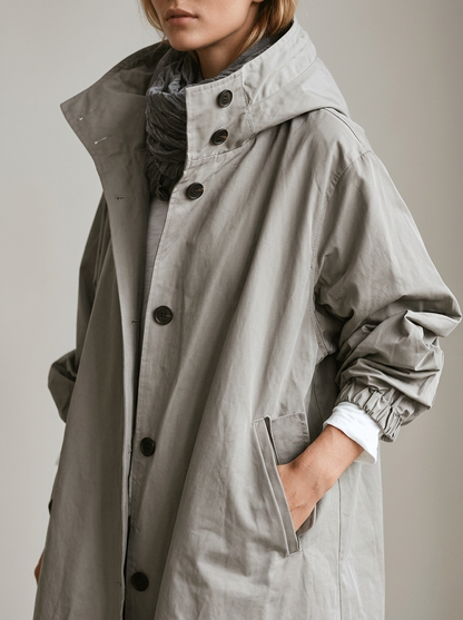 Trenchcoat lungo elegante con cappuccio regolabile
